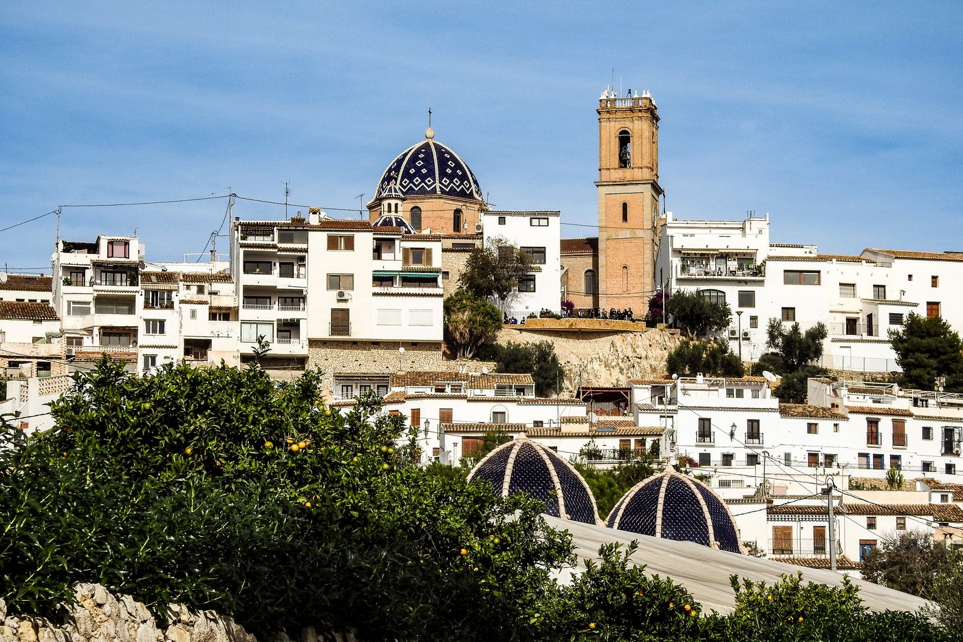 The blue and white ceramic tiled domes of the Nuestra Señora del Consuelo church in Altea